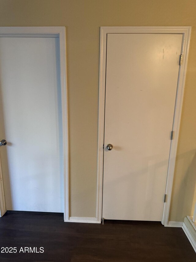 1206 W Pinkley Ave, Coolidge, AZ 85128 - unfurnished bedroom with dark wood-style floors