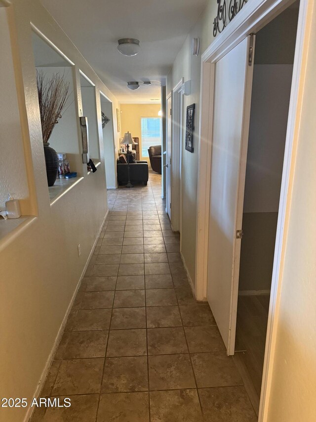 1206 W Pinkley Ave, Coolidge, AZ 85128 - corridor featuring baseboards and tile patterned flooring