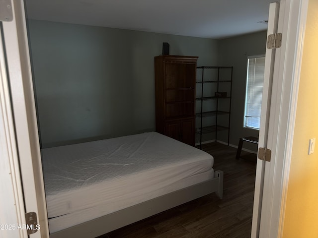 1206 W Pinkley Ave, Coolidge, AZ 85128 - bedroom with visible vents, baseboards, and dark wood finished floors