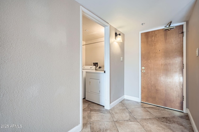 corridor featuring washer and dryer