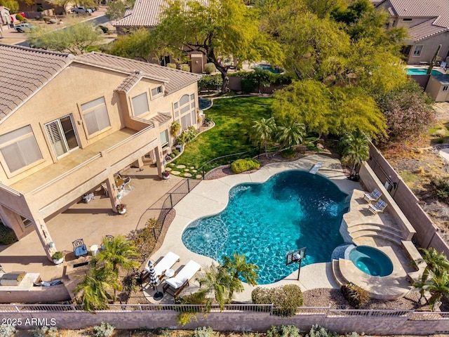 view of swimming pool featuring an in ground hot tub and a patio