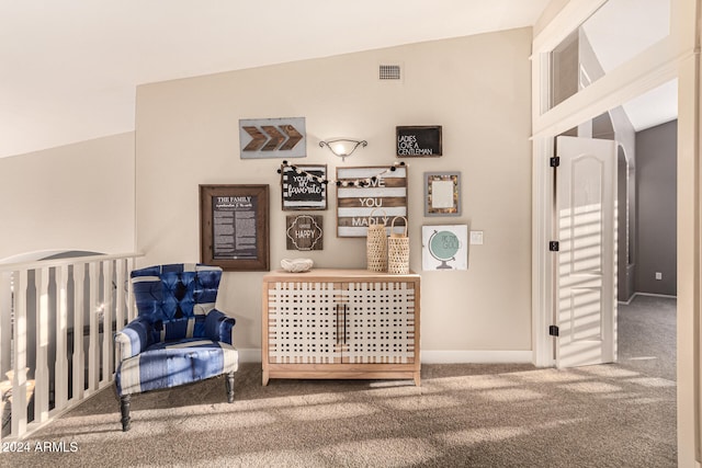 carpeted bedroom with vaulted ceiling