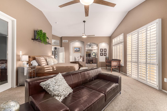 living room featuring vaulted ceiling, carpet, and ceiling fan