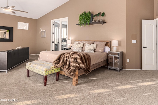 bedroom with ceiling fan, carpet floors, and lofted ceiling