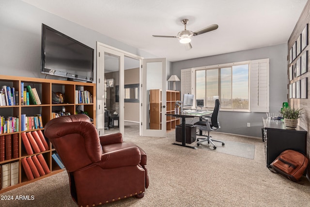 office area with ceiling fan and carpet