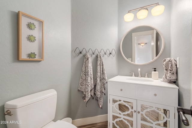 bathroom with toilet and vanity