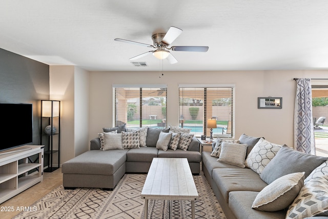 living room featuring ceiling fan