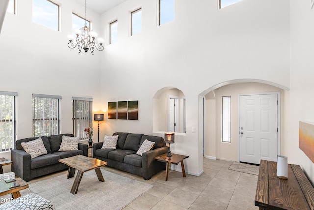 tiled living room with a chandelier