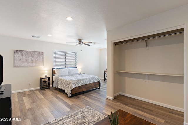 bedroom featuring wood-type flooring and ceiling fan