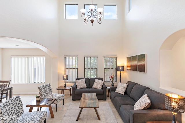 living room featuring light tile patterned floors and a chandelier