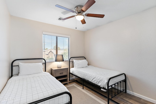 bedroom featuring wood-type flooring and ceiling fan