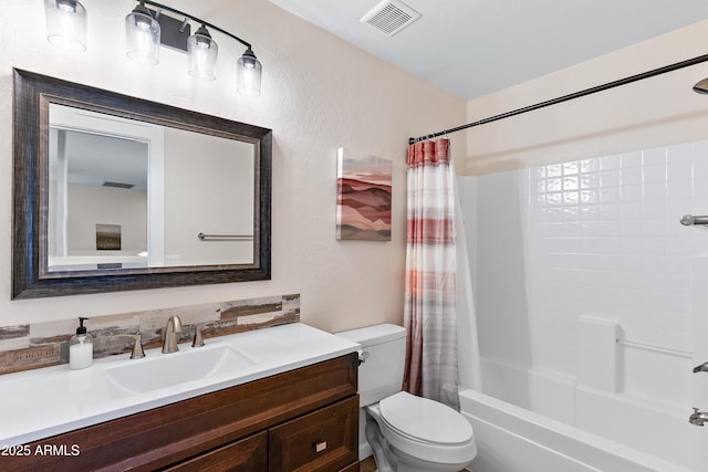 full bathroom with vanity, toilet, and shower / bath combo with shower curtain