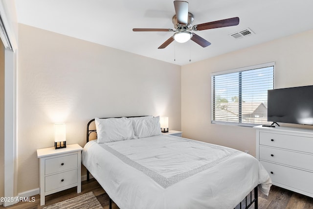 bedroom featuring dark hardwood / wood-style flooring and ceiling fan