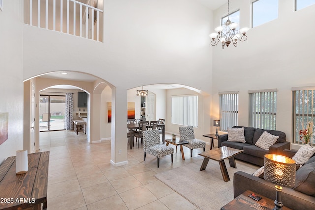 tiled living room with a chandelier