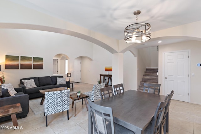 dining room featuring a chandelier and light tile patterned floors