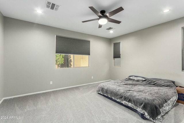 bedroom featuring ceiling fan and carpet