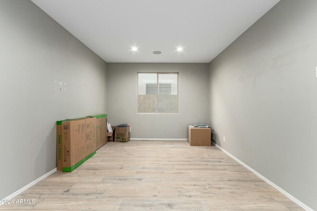 spare room featuring light hardwood / wood-style flooring