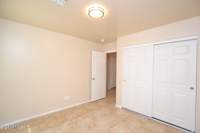 unfurnished bedroom featuring a closet