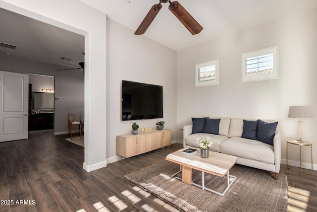 13448 W Miner Trl, Peoria, AZ 85383 - living room featuring a ceiling fan, baseboards, dark wood-style flooring, and lofted ceiling