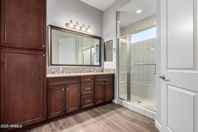 13448 W Miner Trl, Peoria, AZ 85383 - full bathroom with wood finished floors, a shower stall, and double vanity