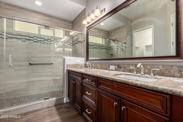 13448 W Miner Trl, Peoria, AZ 85383 - bathroom with a shower stall, double vanity, wood finished floors, and recessed lighting