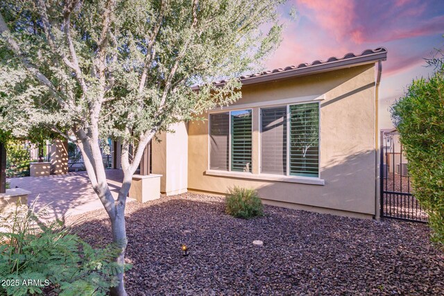 13448 W Miner Trl, Peoria, AZ 85383 - view of front facade featuring a patio and stucco siding