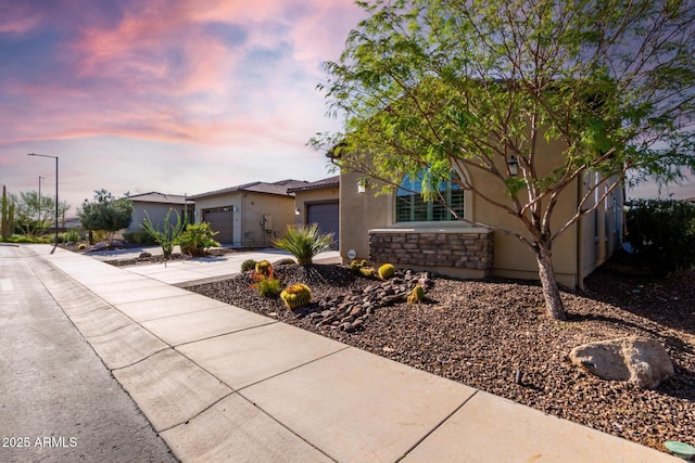 13448 W Miner Trl, Peoria, AZ 85383 - view of front of property featuring stucco siding, concrete driveway, and an attached garage
