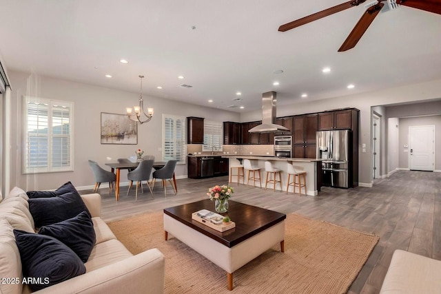 13448 W Miner Trl, Peoria, AZ 85383 - living area with a chandelier, a ceiling fan, recessed lighting, baseboards, and wood finished floors