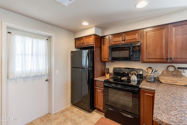 12635 N La Montana Dr Unit 17, Fountain Hills, AZ 85268 - kitchen featuring black appliances, brown cabinetry, light tile patterned flooring, and recessed lighting