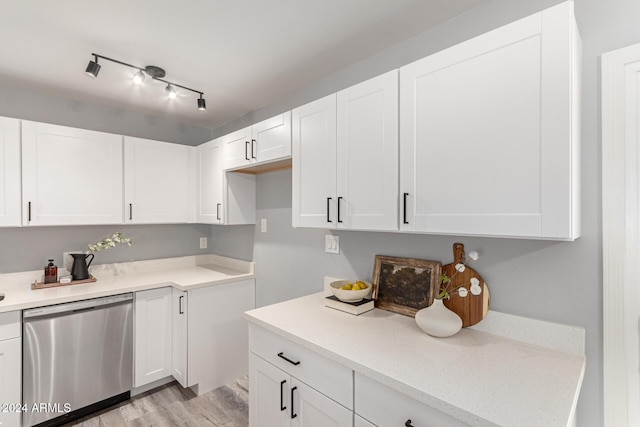 kitchen featuring dishwasher, white cabinets, light hardwood / wood-style flooring, and light stone countertops