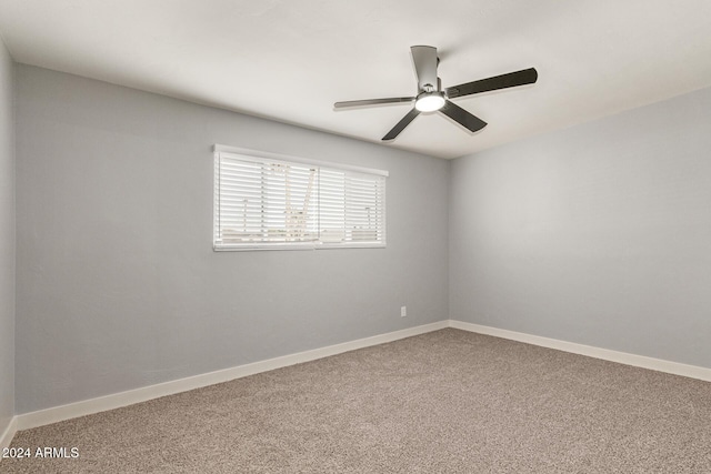 empty room featuring ceiling fan and carpet floors