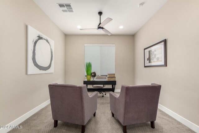 carpeted office with ceiling fan