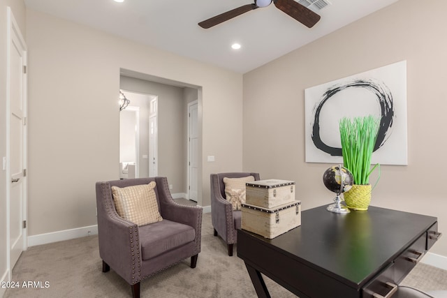 carpeted home office with ceiling fan