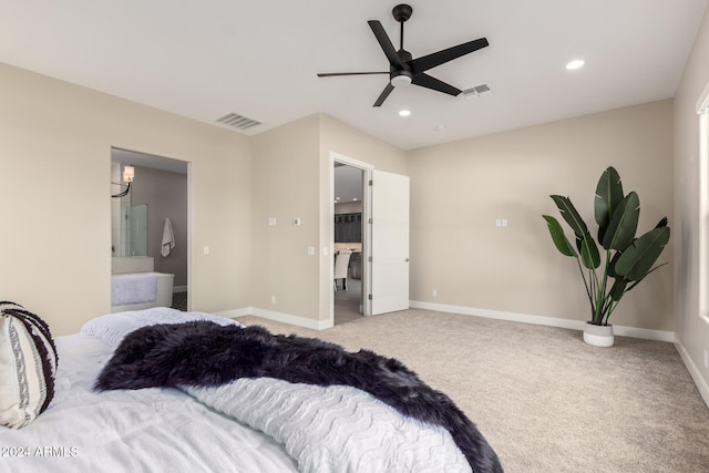 carpeted bedroom featuring ensuite bathroom and ceiling fan