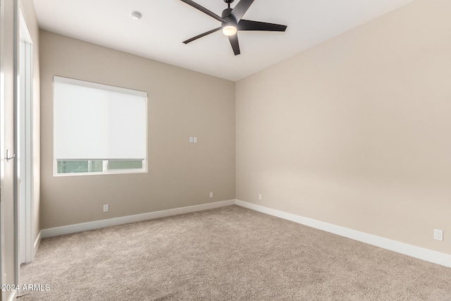 carpeted empty room with ceiling fan