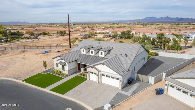 birds eye view of property with a mountain view