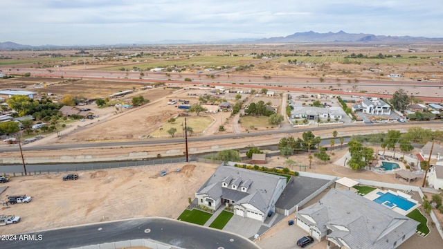 birds eye view of property featuring a mountain view