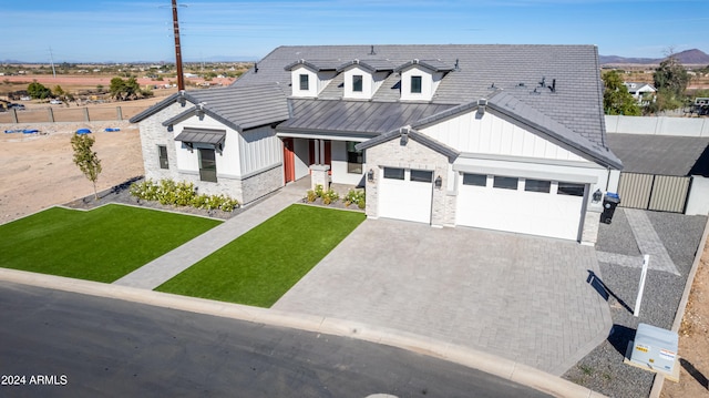 view of front facade with a garage and a front yard