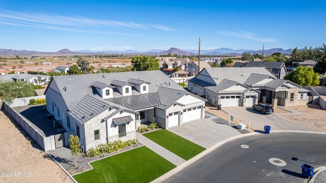 birds eye view of property with a mountain view