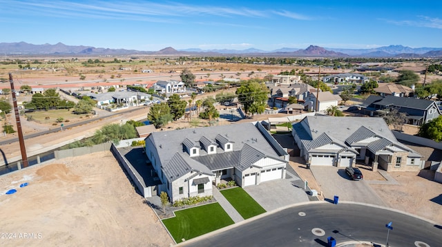 birds eye view of property featuring a mountain view