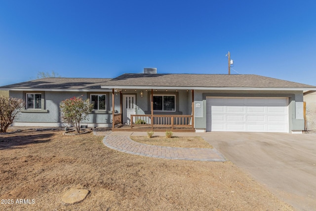 ranch-style home with a garage and covered porch