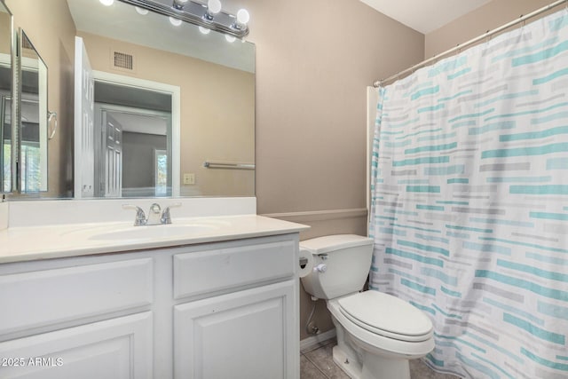 bathroom with vanity, a shower with curtain, tile patterned floors, and toilet