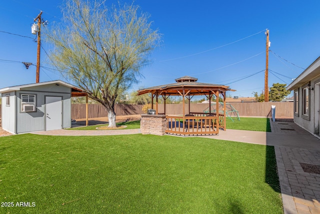 view of yard with a gazebo and a storage unit