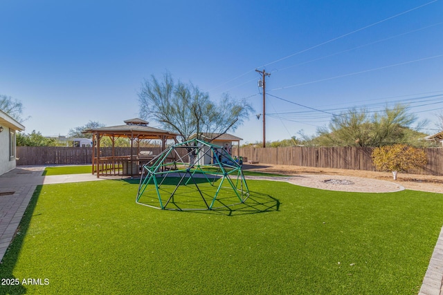 view of yard with a gazebo and a playground