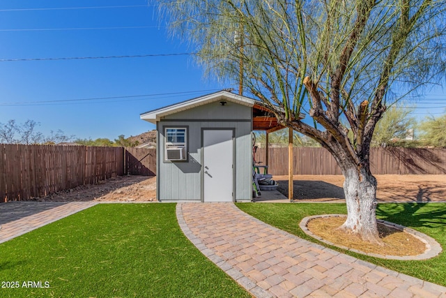 view of outbuilding featuring a lawn