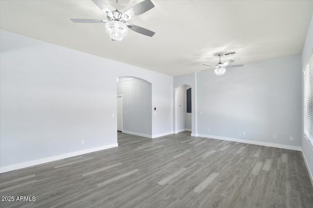 empty room featuring wood-type flooring and ceiling fan