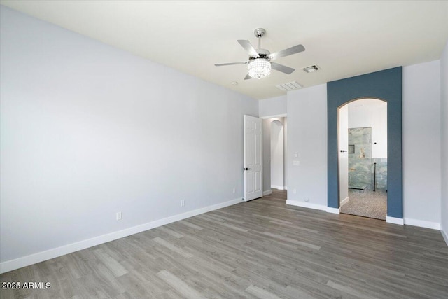 unfurnished bedroom featuring hardwood / wood-style flooring and ceiling fan