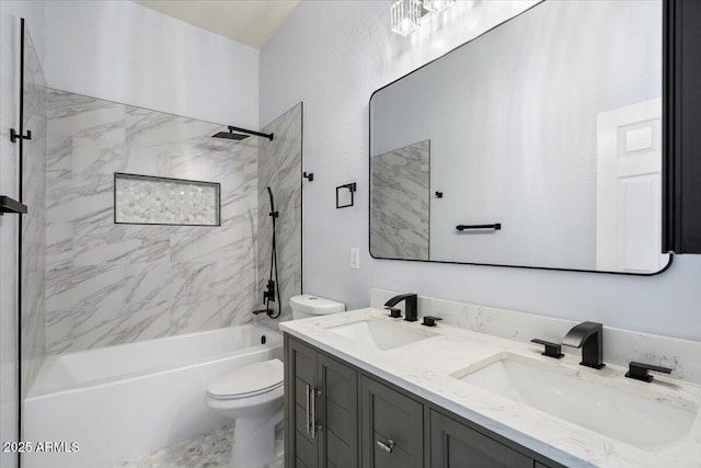 full bathroom with tiled shower / bath combo, toilet, and vanity