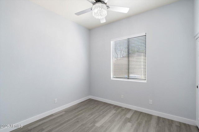 unfurnished room with light hardwood / wood-style flooring and ceiling fan