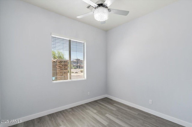 unfurnished room featuring ceiling fan and hardwood / wood-style flooring